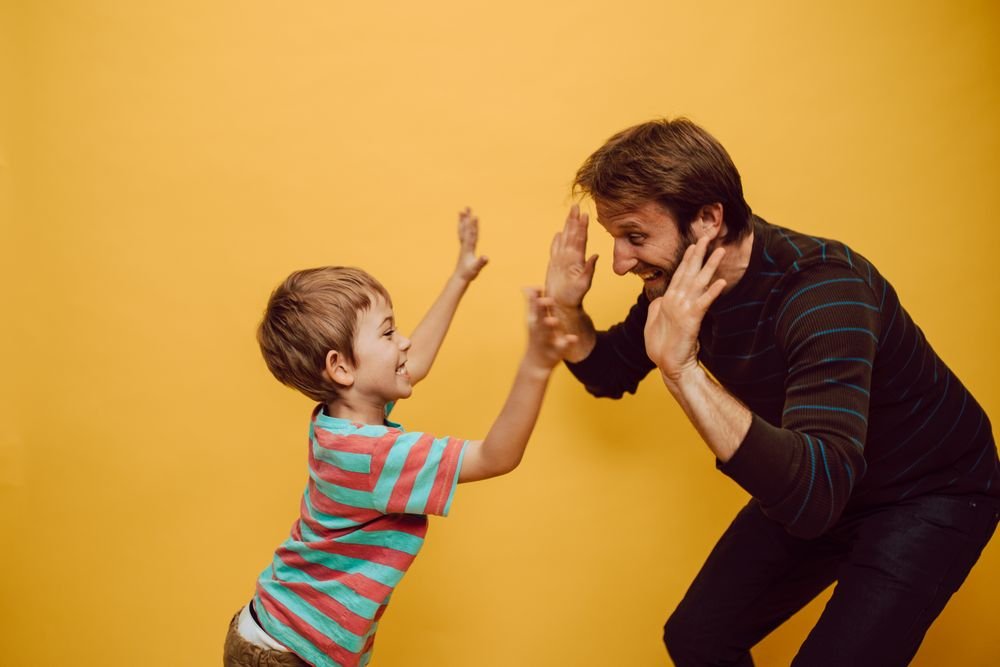 High five tussen vader en zoon